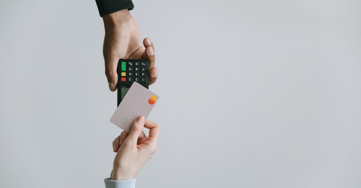 Can I buy SL Access card with Credit Card? - Person Holding White and Black Smartphone