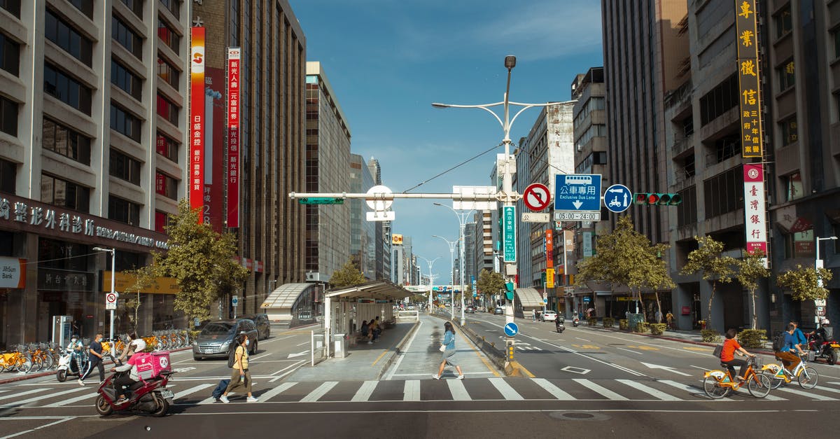 Can I cancel hotel reservation AFTER crossing immigration in Schengen area? [duplicate] - People Crossing the Pedestrian Lane