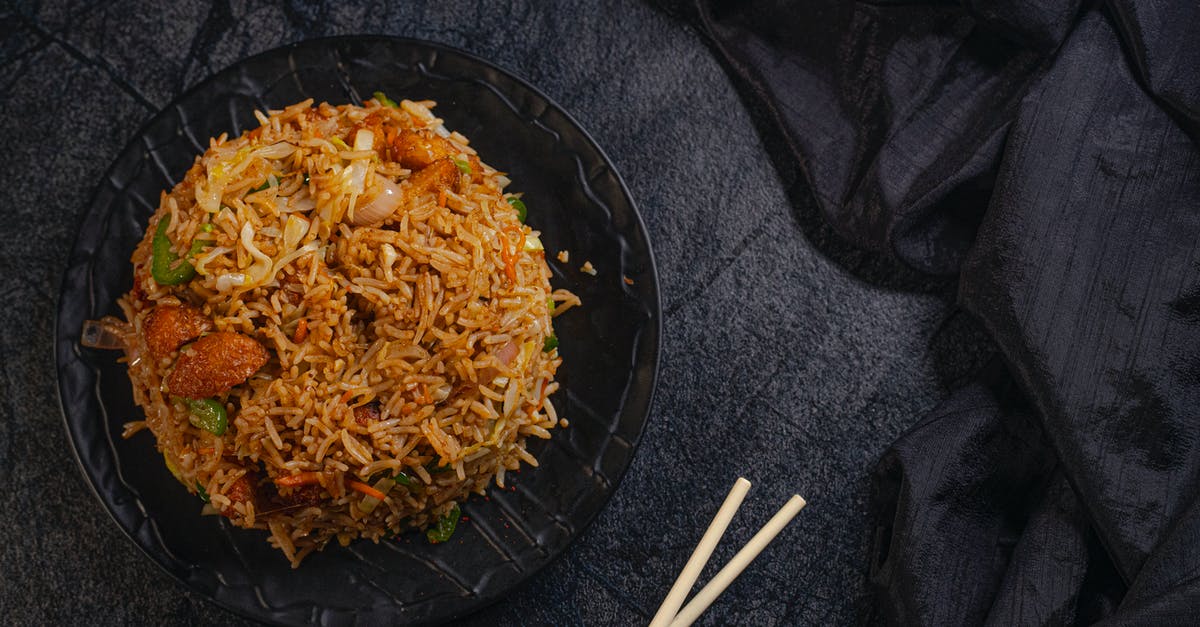 Can I carry fried rice and dried chicken preparation? - Appetizing Asian dish with rice Can I carry fried rice and dried chicken preparation? - Appetizing Asian dish with rice