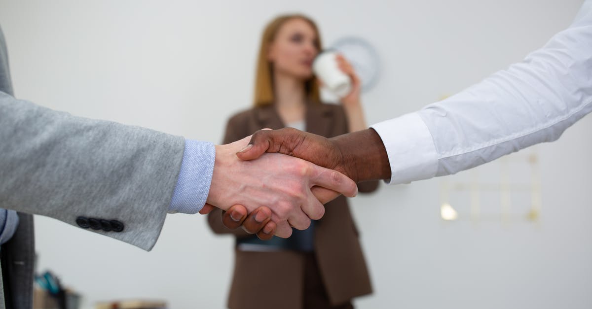 Can I carry One office laptop, one personal laptop and one Surface tablet? [duplicate] - Man in White Dress Shirt and Brown Pants Holding Hands With Woman in Brown Mini Skirt