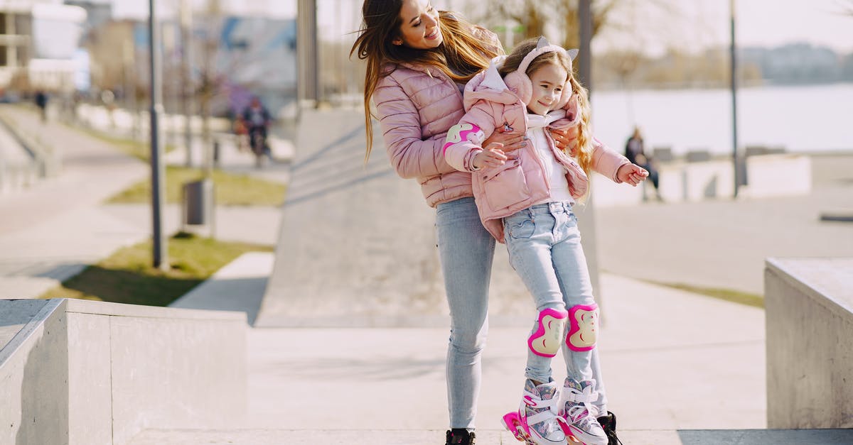 Can I carry roller blades in cabin baggage? - Full body smiling mother carrying little girl wearing protection pads while roller skating on concrete ramp during active leisure in sunny spring day Can I carry roller blades in cabin baggage? - Full body smiling mother carrying little girl wearing protection pads while roller skating on concrete ramp during active leisure in sunny spring day