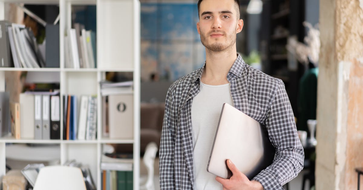 Can I carry work laptop to USA as a L2 dependent? - A Man Carrying a Laptop Can I carry work laptop to USA as a L2 dependent? - A Man Carrying a Laptop