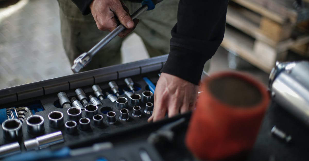 Can I check in a golfing size umbrella as my 3rd check in luggage? - Crop mechanic choosing metal tools for repair in garage Can I check in a golfing size umbrella as my 3rd check in luggage? - Crop mechanic choosing metal tools for repair in garage