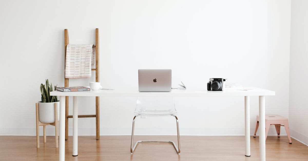 Can I check in at a desk (JFK) from inside security? - Silver MacBook on White Table Can I check in at a desk (JFK) from inside security? - Silver MacBook on White Table