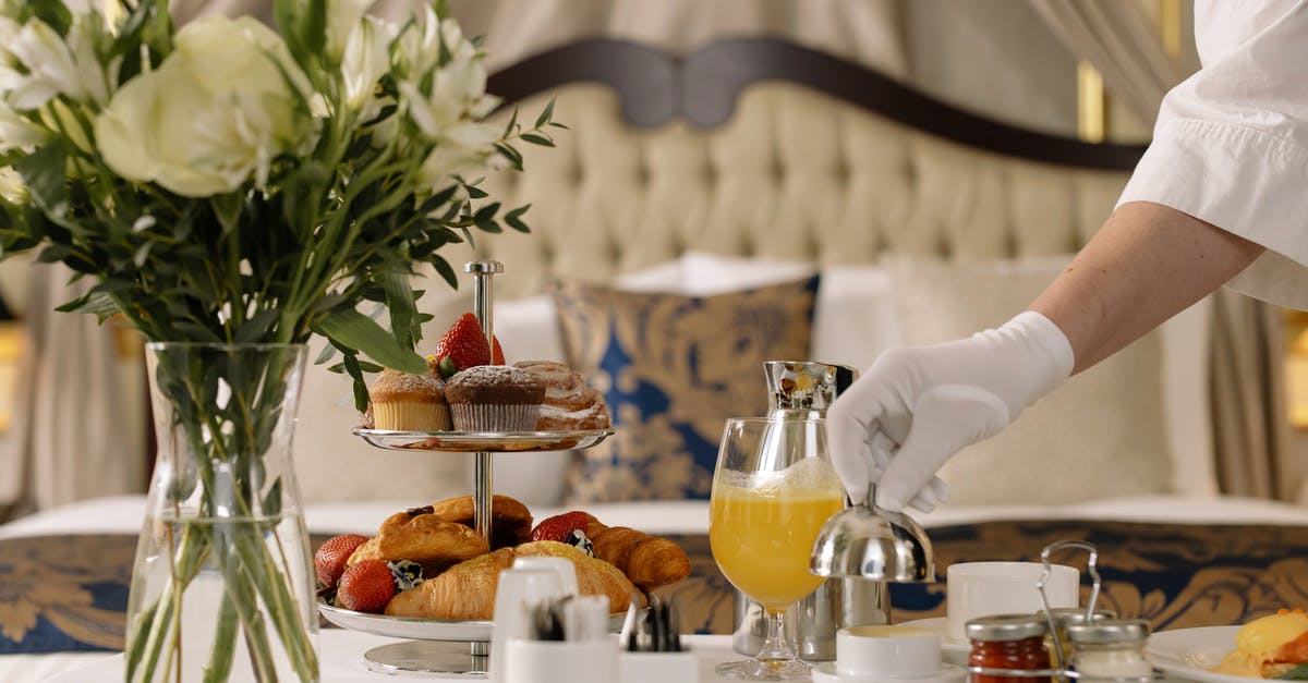 Can I check into a European hotel without my passport? [duplicate] - Person Checking Order From Hotel Room Service