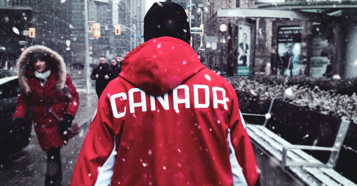 Can I come back to Canada with an expired passport? - Man in Red Hoodie Walking on Sidewalk Can I come back to Canada with an expired passport? - Man in Red Hoodie Walking on Sidewalk
