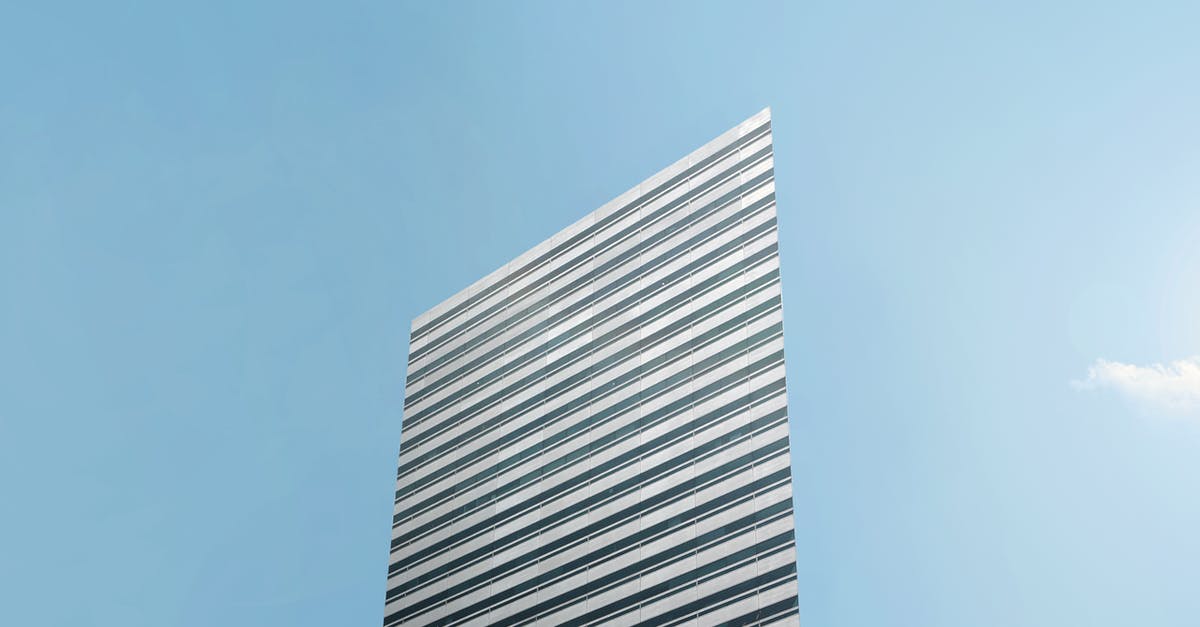 Can I credit mileage on Garuda to Singapore or Qantas? - White Concrete Building Under Blue Sky