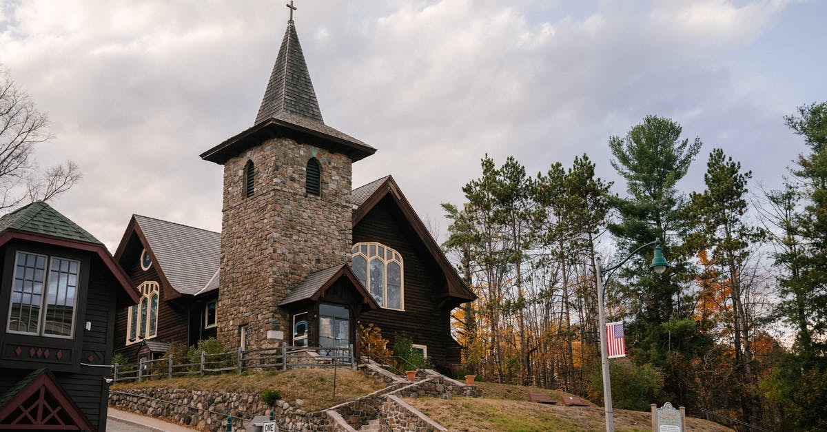 Can I cross the US border by land without a US Passport if I am a US Naturalized citizen - Low angle of ancient St Eustace Episcopal Church with cross on sharp roof located on hill surrounded by autumn trees against cloudy sky in Lake Placid Can I cross the US border by land without a US Passport if I am a US Naturalized citizen - Low angle of ancient St Eustace Episcopal Church with cross on sharp roof located on hill surrounded by autumn trees against cloudy sky in Lake Placid