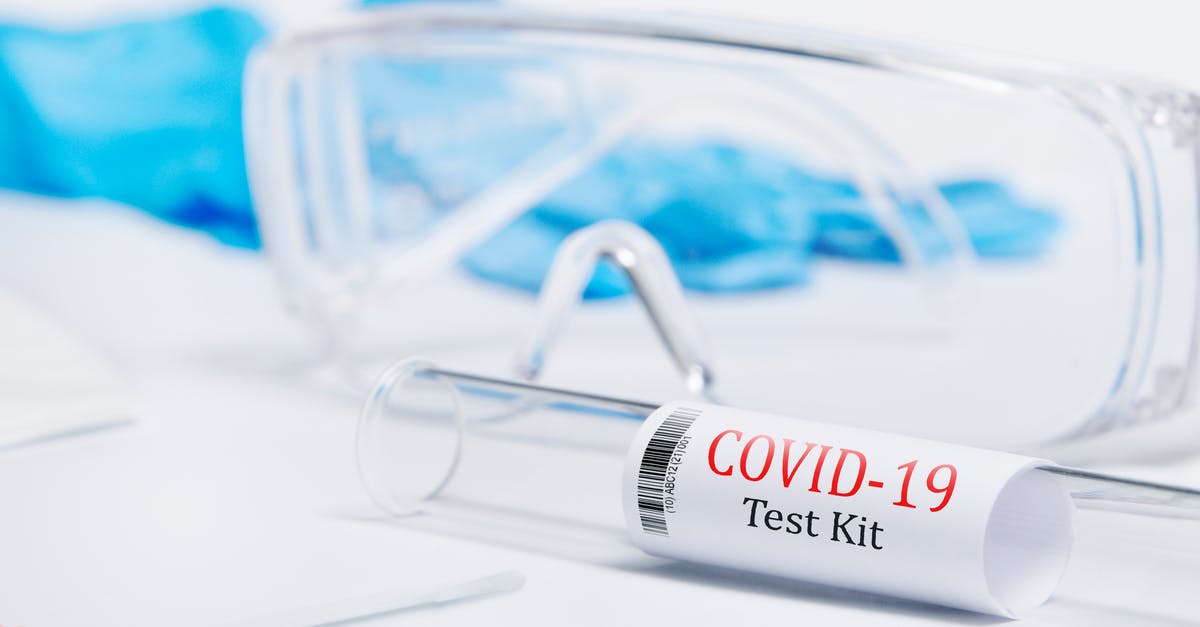 Can I enter Canada, have a COVID-19 test then continue to another country? - Kit tested Covid-19 , Coronavirus symptoms medical concept with PPE and Swab PCR test on white background isolated , Glasses, mask, gloves for protection against the virus	
