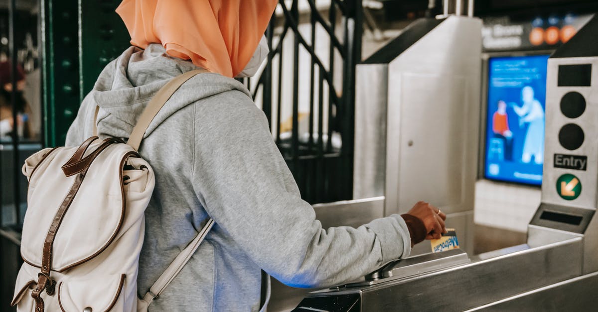 Can I enter France with an Italian Schengen Visa under coronavirus situation? [closed] - Back view Muslim woman in casual outfit and hijab with backpack using travel card for passing metro gate at daytime