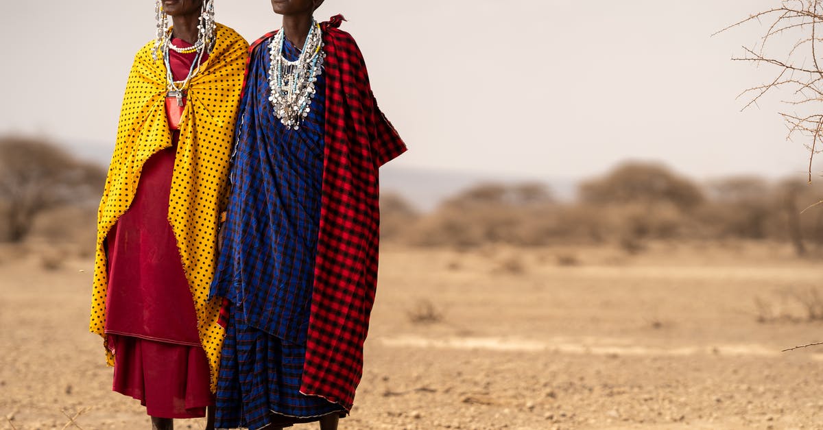 Can I enter Kenya and Tanzania multiple times on single-entry visas? - People Wearing Checkered Tribal Clothes Standing on the Desert Can I enter Kenya and Tanzania multiple times on single-entry visas? - People Wearing Checkered Tribal Clothes Standing on the Desert