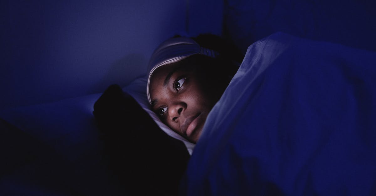 Can I enter Oman twice in a short period of time, using a visa-on-arrival? [closed] - Woman Using a Cellphone during Bedtime