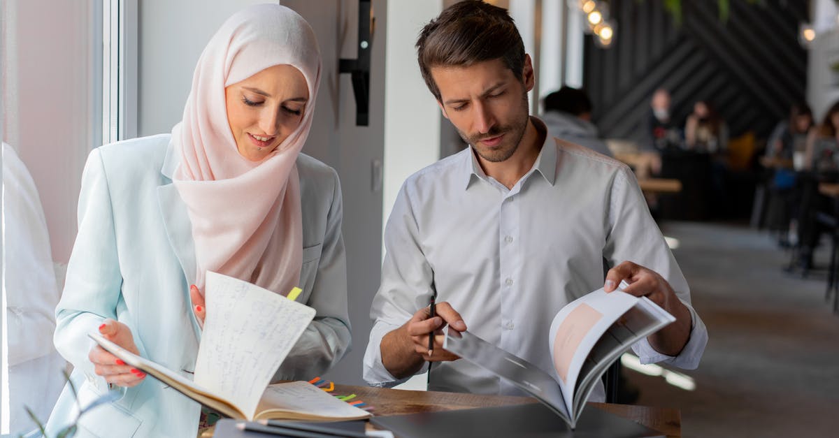 Can I enter the UK prior to the start of my student visa? [duplicate] - Man in White Thobe Holding Black Pen and White Paper