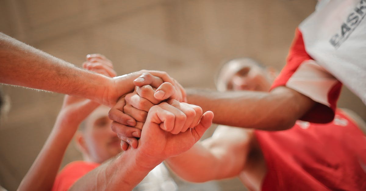 Can I enter the UK with my family visit visa while my settlement visa was refused and waiting for the tribunal court hearing? - From below of crop multiethnic team of professional basketball players gathering and putting hands together while standing on playground before game Can I enter the UK with my family visit visa while my settlement visa was refused and waiting for the tribunal court hearing? - From below of crop multiethnic team of professional basketball players gathering and putting hands together while standing on playground before game
