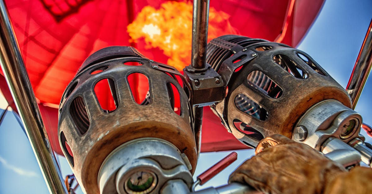 Can I fly in and out of Australia with an unpaid fire related fine? [closed] - Red Hot Air Balloon Photo