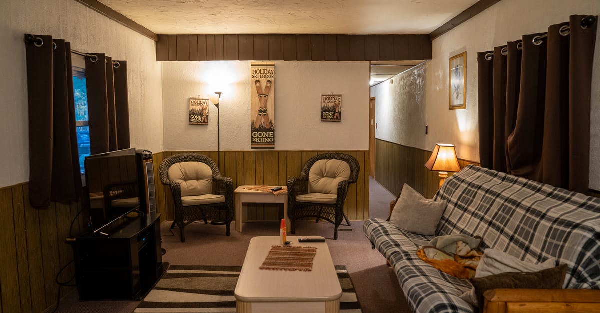 Can I get a hotel room in the US when I am 18 years old? - Interior of traditional house with wooden furniture and comfortable sofa and armchairs Can I get a hotel room in the US when I am 18 years old? - Interior of traditional house with wooden furniture and comfortable sofa and armchairs