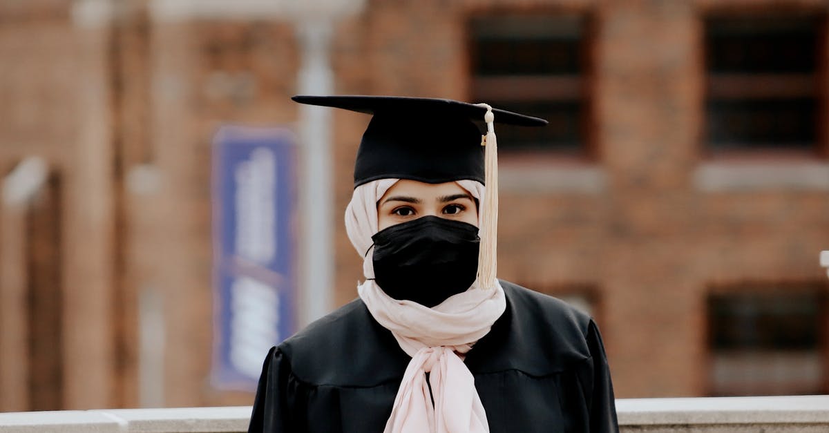 Can I get a student visa through the Spanish Embassy in New Delhi? [closed] - Woman Wearing a Graduation Hat and a Face Mask