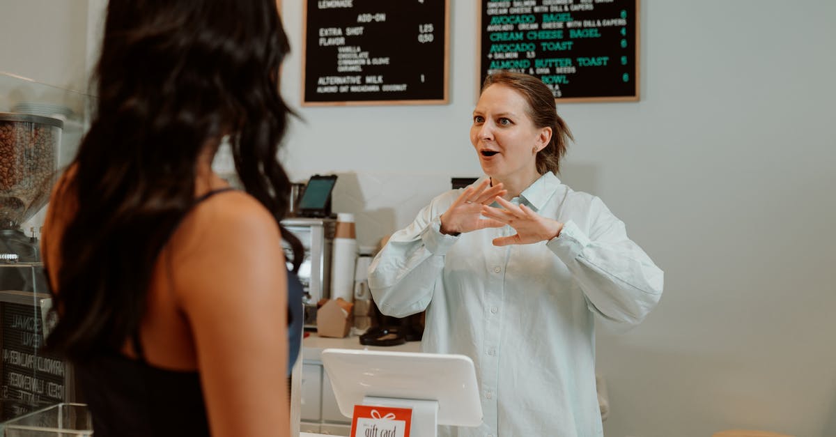 Can I get Diamox over the counter in Nairobi? - Cashier behind a Counter in front of a Customer Can I get Diamox over the counter in Nairobi? - Cashier behind a Counter in front of a Customer