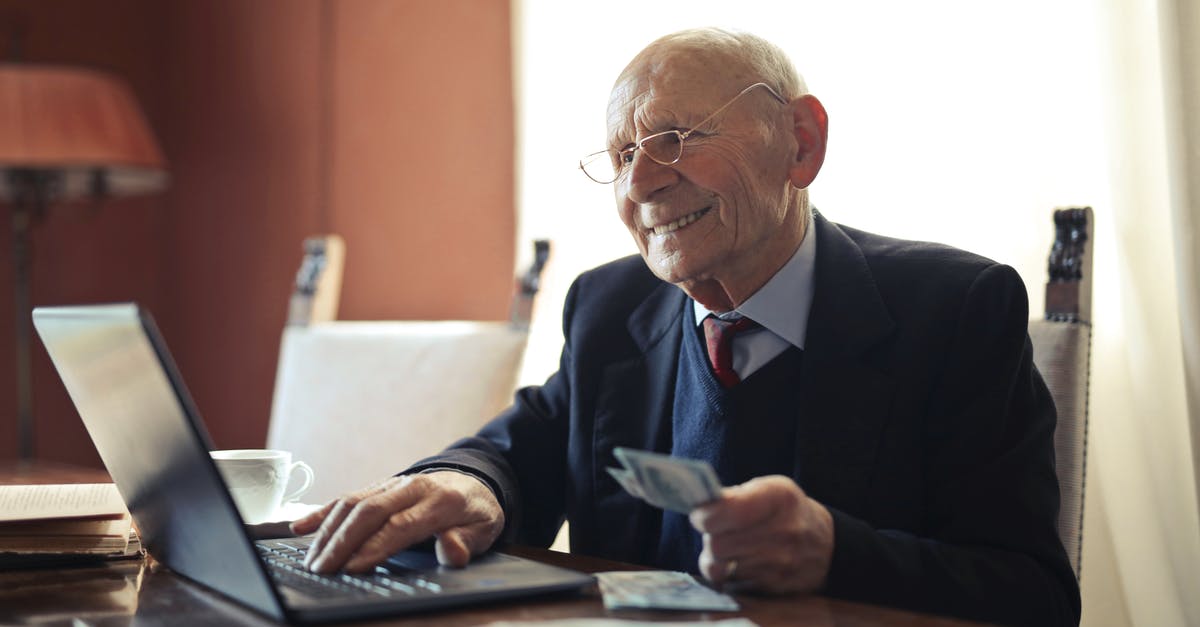 Can I hold two different types of Schengen Visa (Tourist Type-C and Work Type-D) at the same time? [duplicate] - Positive senior businessman typing on laptop while holding money in hand