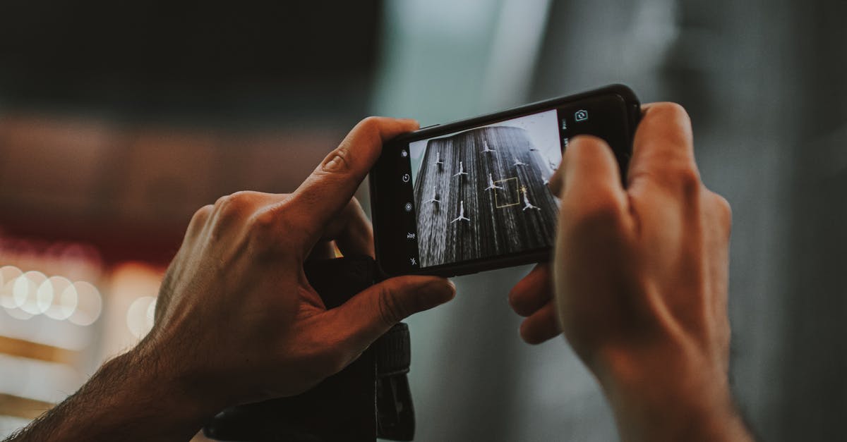 Can I include both business and tourism in one Schengen application? - Person Holding Black Android Smartphone Can I include both business and tourism in one Schengen application? - Person Holding Black Android Smartphone