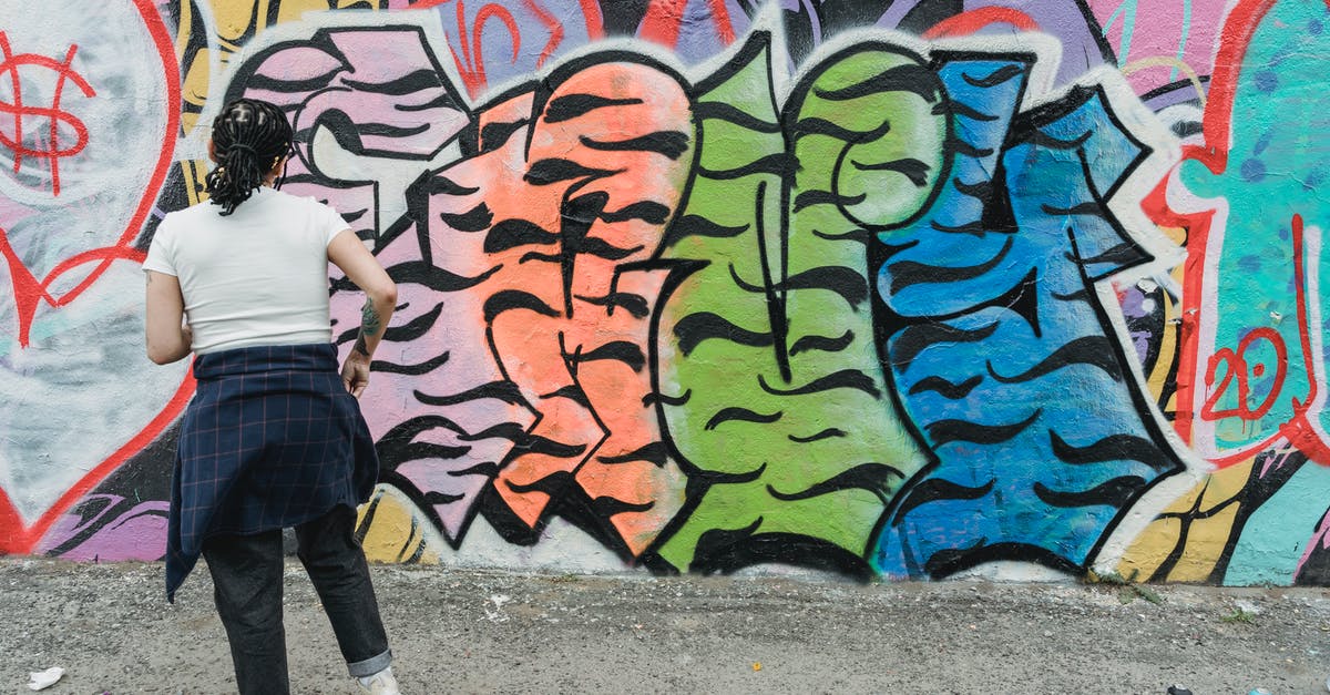 Can I make a 1hr full-transfer at Stansted? - Unrecognizable woman painting creative graffiti Can I make a 1hr full-transfer at Stansted? - Unrecognizable woman painting creative graffiti