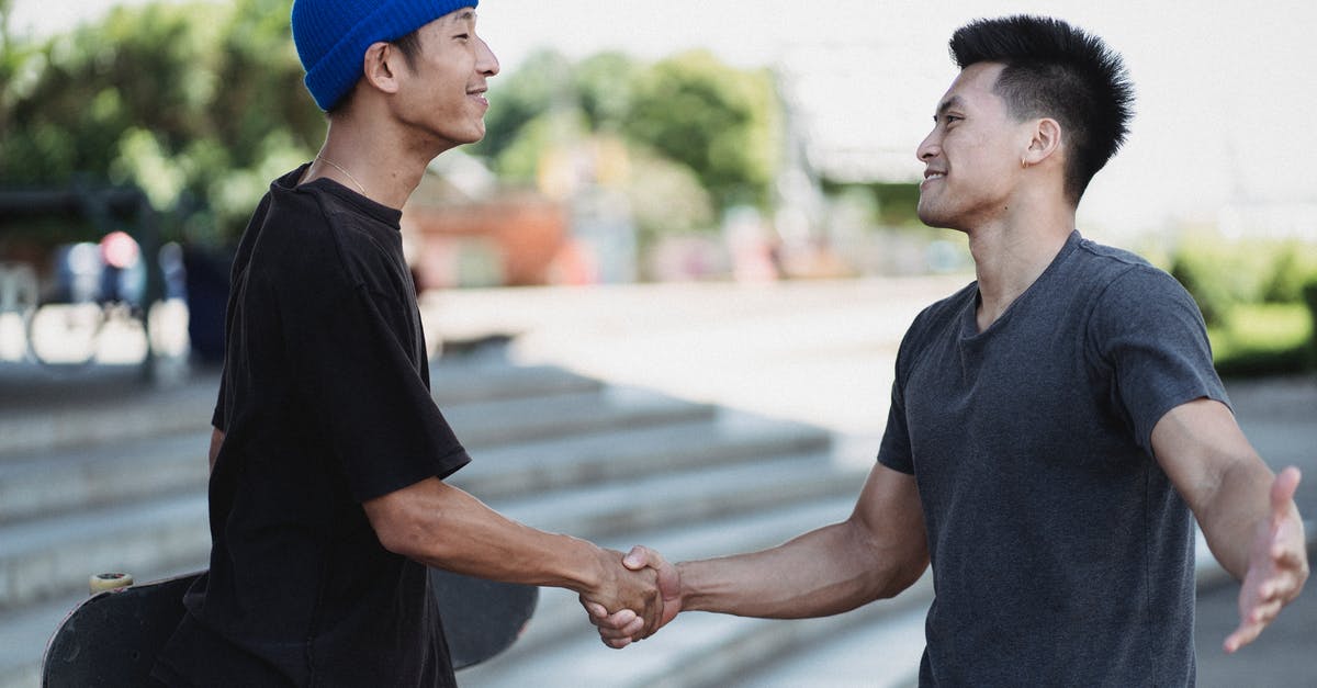 Can I meet my friend during a connecting flight? (LHR) - Content Asian men shaking hands on sunny street Can I meet my friend during a connecting flight? (LHR) - Content Asian men shaking hands on sunny street
