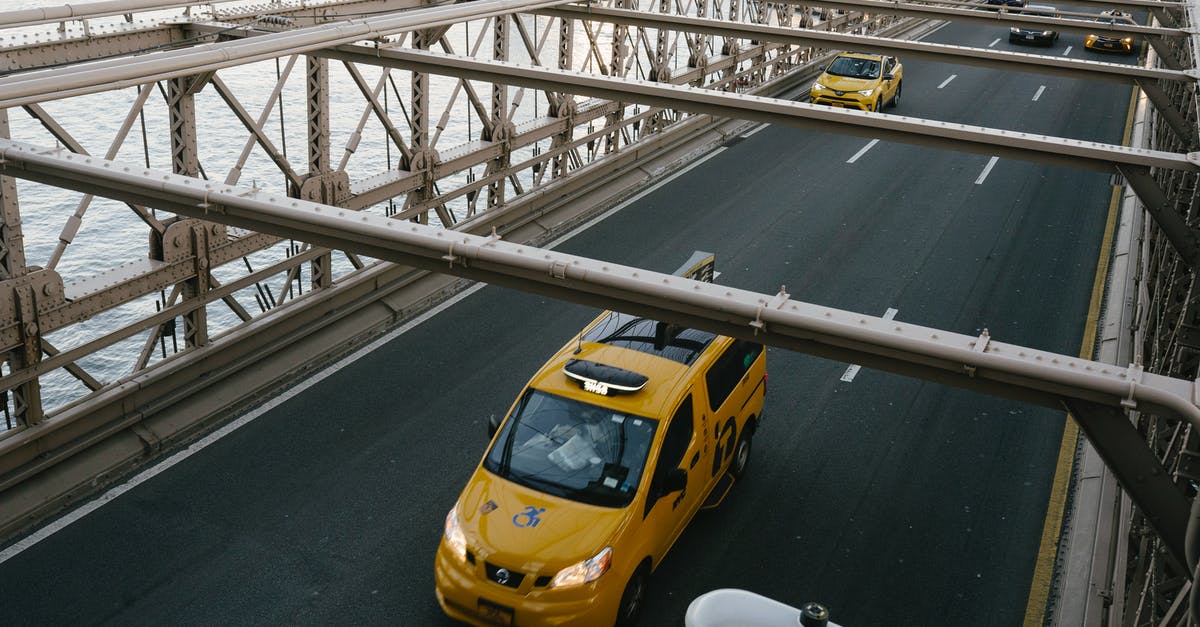 Can I move to Germany from the US during COVID? - Taxi cabs driving on suspension bridge