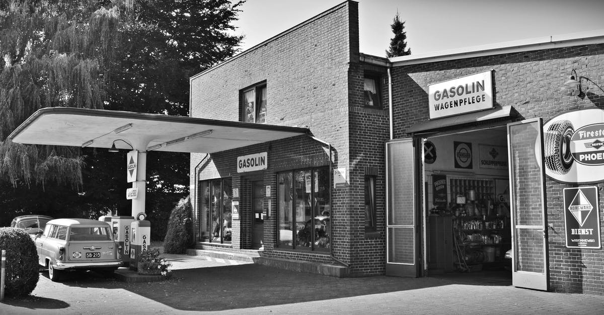 Can I pump my own gas in New Jersey, USA? - Gray Scale Photo of a Sedan Parked Infront of Store Can I pump my own gas in New Jersey, USA? - Gray Scale Photo of a Sedan Parked Infront of Store