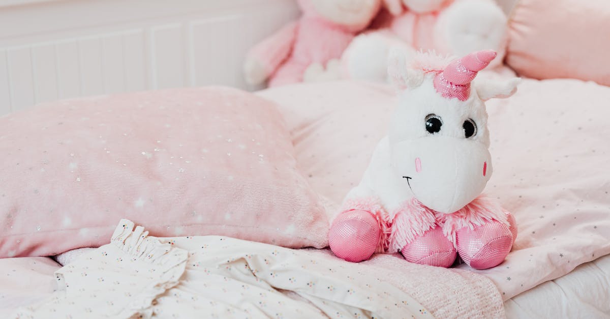 Can I put a bed quilt/blanket in airplane's cargo? - White and Pink Unicorn Plush Toy on Bed Can I put a bed quilt/blanket in airplane's cargo? - White and Pink Unicorn Plush Toy on Bed