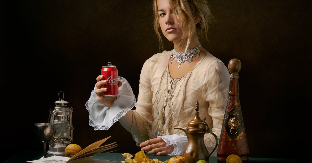 Can I really "wear" my luggage? - Woman Holding A Drink Can I really "wear" my luggage? - Woman Holding A Drink