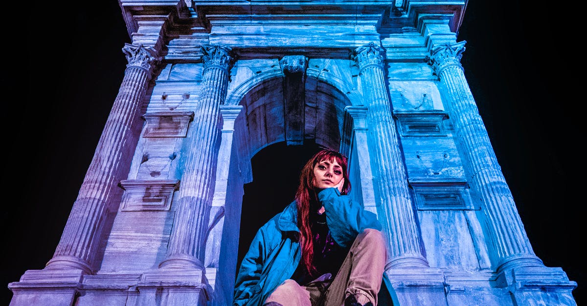 Can I re-enter Italy with Carta di identità and Carta di soggiorno? - Woman in Blue Jacket Sitting Beside Arco di Traiano Can I re-enter Italy with Carta di identità and Carta di soggiorno? - Woman in Blue Jacket Sitting Beside Arco di Traiano