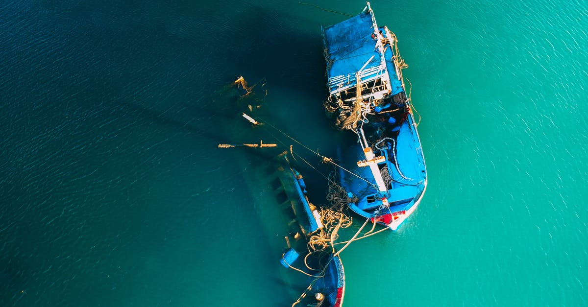 Can I rent a motorized boat on Koh Phi Phi Don without a license? - From above picturesque view of boats floating in ocean bright green water in daylight Can I rent a motorized boat on Koh Phi Phi Don without a license? - From above picturesque view of boats floating in ocean bright green water in daylight