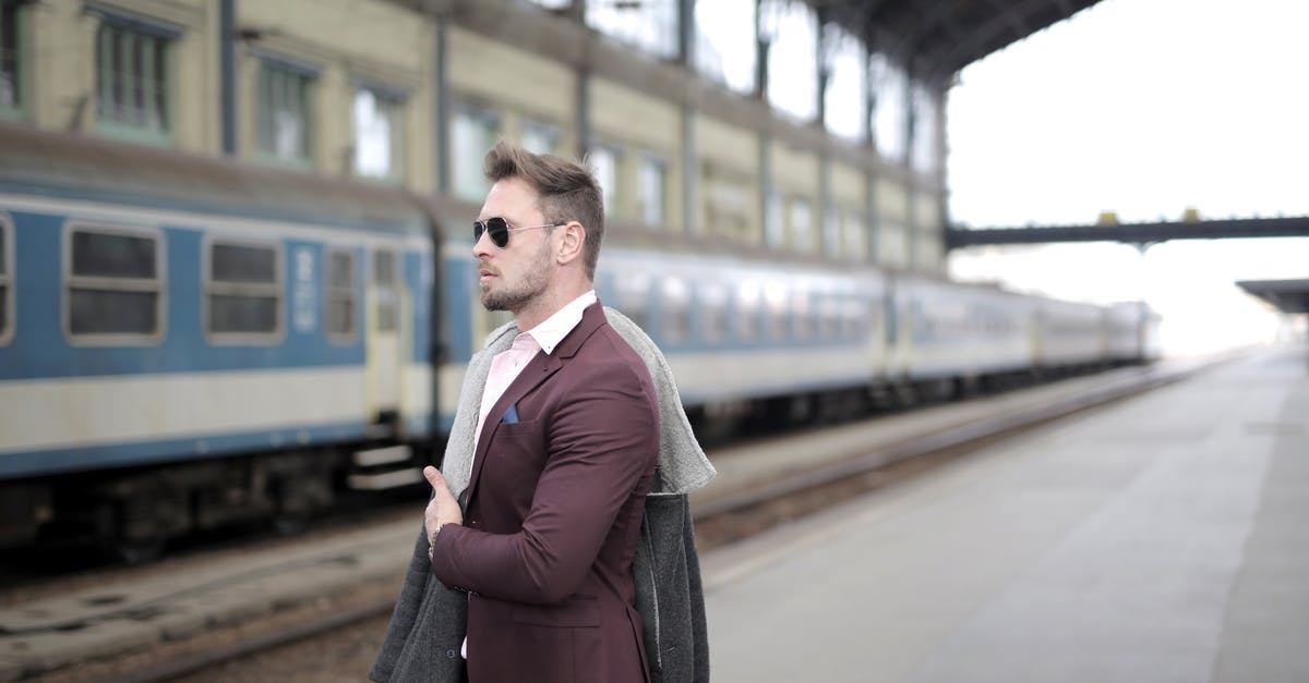 Can I search for European train connections avoiding certain stations? - Confident stylish passenger standing on railway station and waiting for departure Can I search for European train connections avoiding certain stations? - Confident stylish passenger standing on railway station and waiting for departure