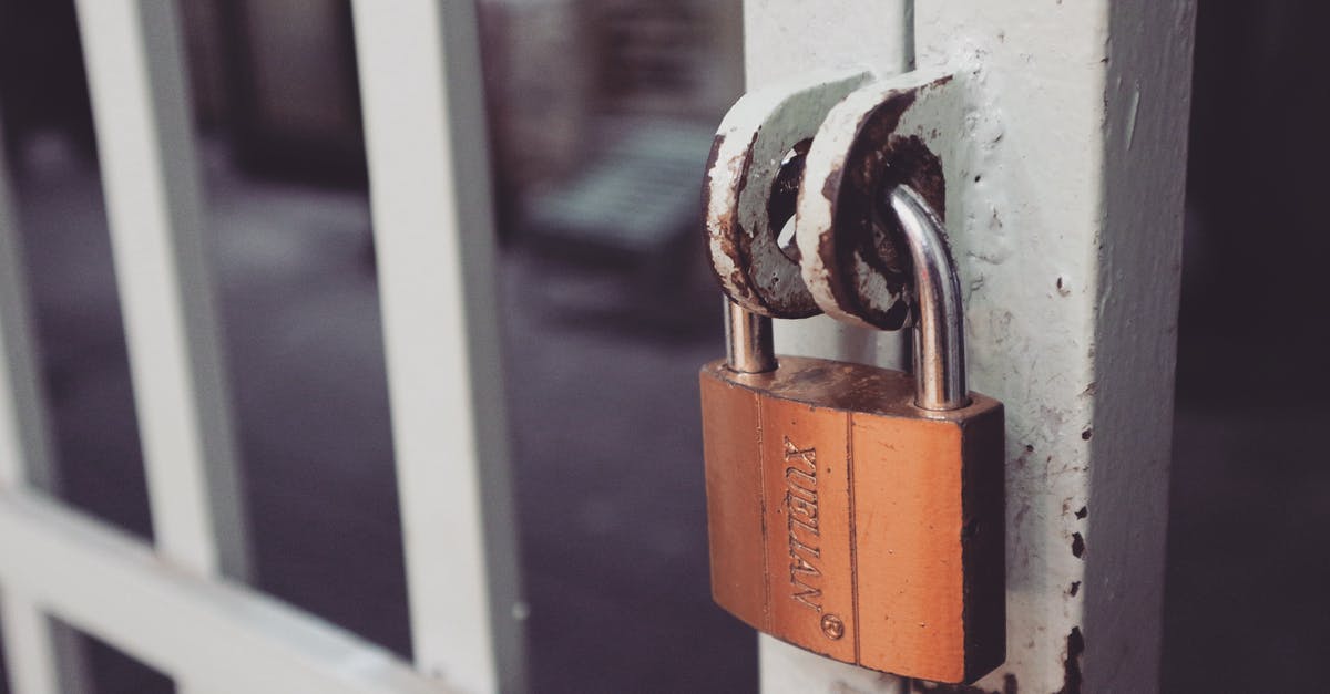Can I stay airside at Stansted after the security gates are closed? - Closeup Photography of White Gate With Brass-colored Padlock Can I stay airside at Stansted after the security gates are closed? - Closeup Photography of White Gate With Brass-colored Padlock