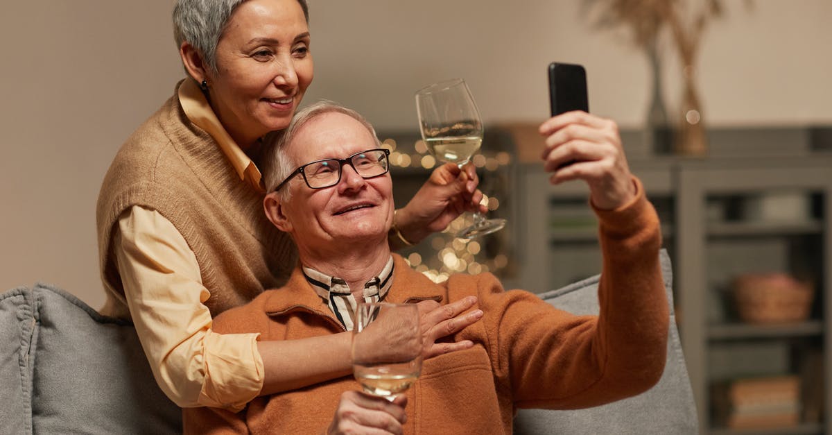 Can I take a case of wine transiting through Dubai? - Couple Taking a Selfie Can I take a case of wine transiting through Dubai? - Couple Taking a Selfie