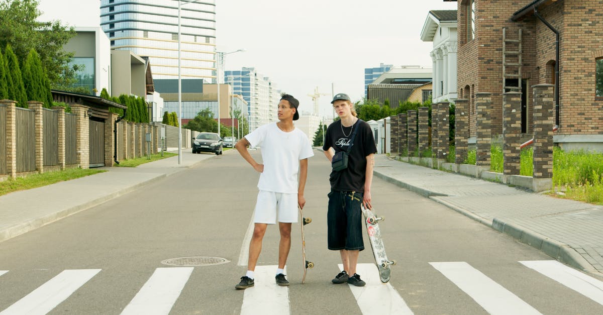 Can I take a two pin travel adapter plug in my hand luggage? - Man in White Crew Neck T-shirt and Brown Shorts Holding Black and White Skateboard Can I take a two pin travel adapter plug in my hand luggage? - Man in White Crew Neck T-shirt and Brown Shorts Holding Black and White Skateboard