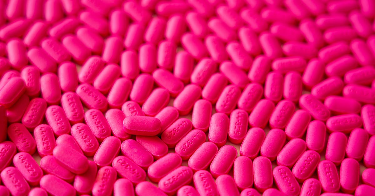 Can I take motion sickness pills abroad without a doctor's note? - Pink Medicine Tablets In Close-up View
