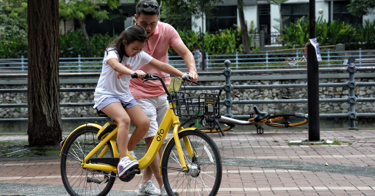 Can I take my bicycle into all German trains? - Photography of Girl Riding Bike Beside Man Can I take my bicycle into all German trains? - Photography of Girl Riding Bike Beside Man