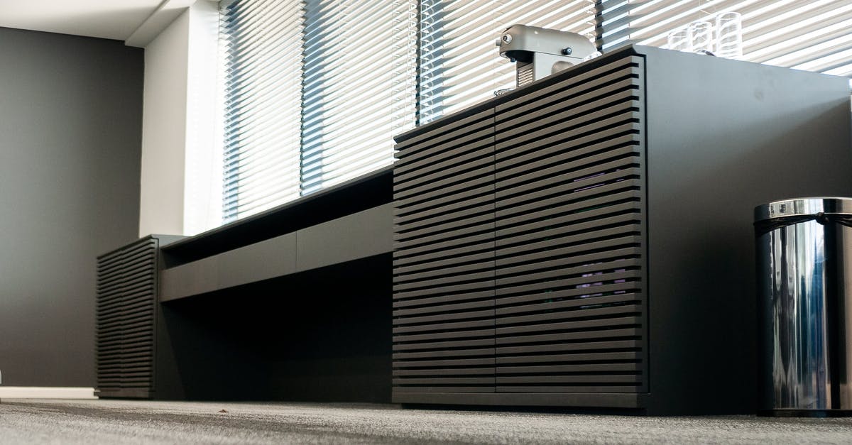 Can I take my electric skateboard to Russia? - Table with coffee machine near trash can in modern workspace Can I take my electric skateboard to Russia? - Table with coffee machine near trash can in modern workspace