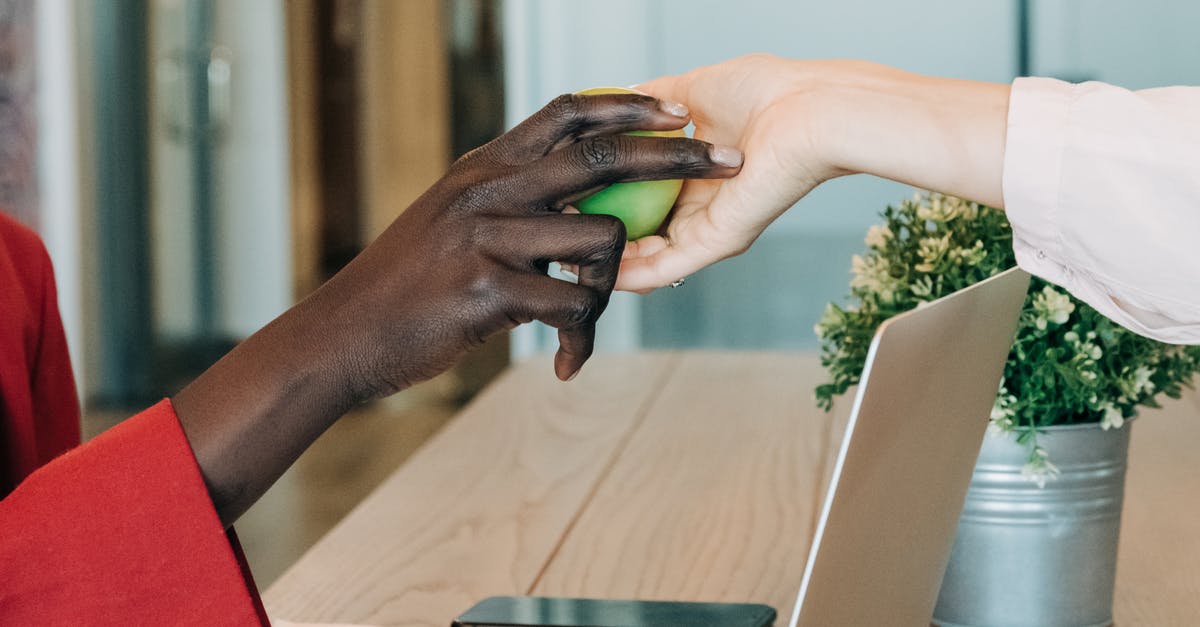 Can I take sealed PC parts in the plane from UK to Morocco? - Black businesswoman taking green apple from colleague at workplace Can I take sealed PC parts in the plane from UK to Morocco? - Black businesswoman taking green apple from colleague at workplace