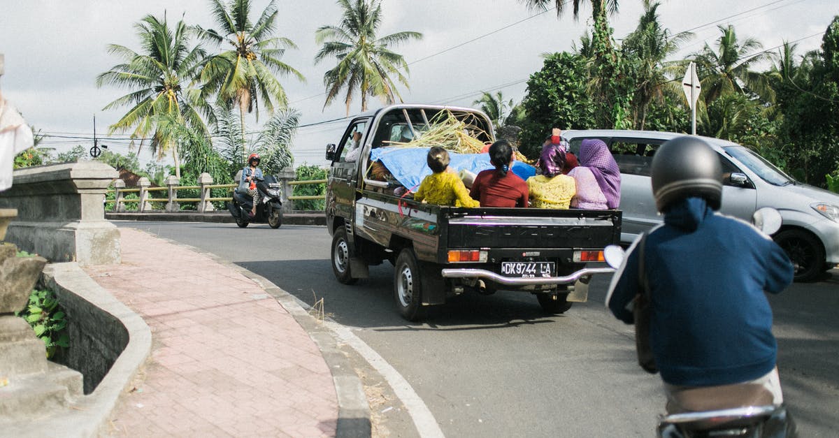 Can I take the 00:05 bus back with a rail-air day return? - Faceless people on road in daytime