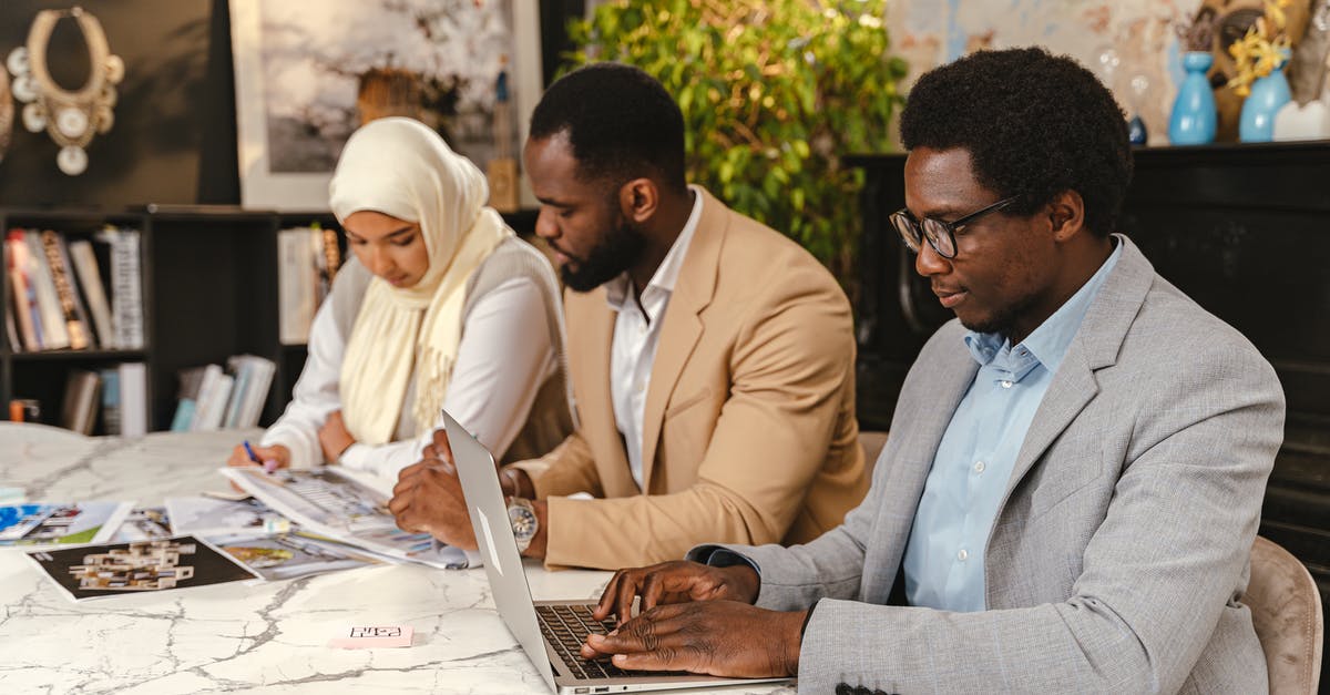 Can I temporarily work in my company's office in the Schengen area on a type C Schengen visa working in the UK on a Tier 2 visa? - Man Typing on Laptop while in a Meeting Can I temporarily work in my company's office in the Schengen area on a type C Schengen visa working in the UK on a Tier 2 visa? - Man Typing on Laptop while in a Meeting