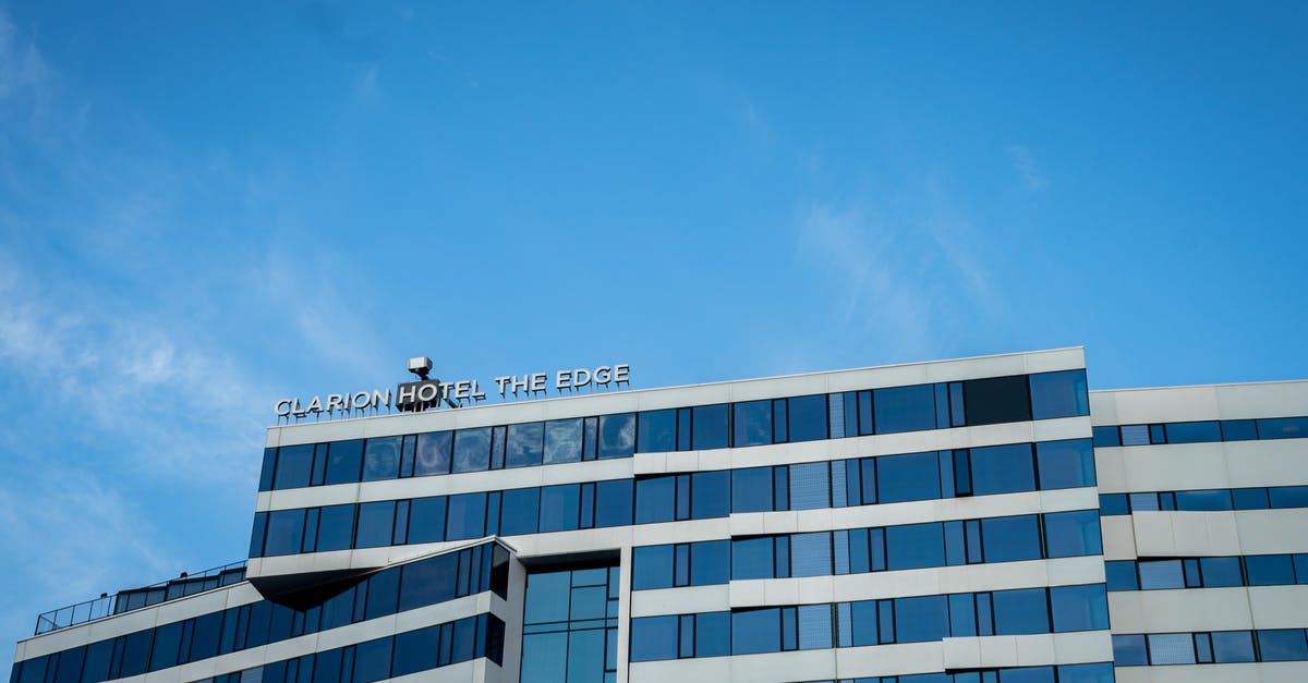 Can I transfer my hotel reservation? - White Concrete Building Under Blue Sky Can I transfer my hotel reservation? - White Concrete Building Under Blue Sky