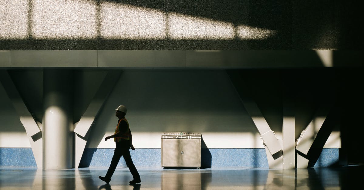 Can I transfer through Vancouver airport without Canada visa? Air Canada and Turkish Citizen [duplicate] - Woman in Yellow Shirt and Black Pants Walking on White Floor