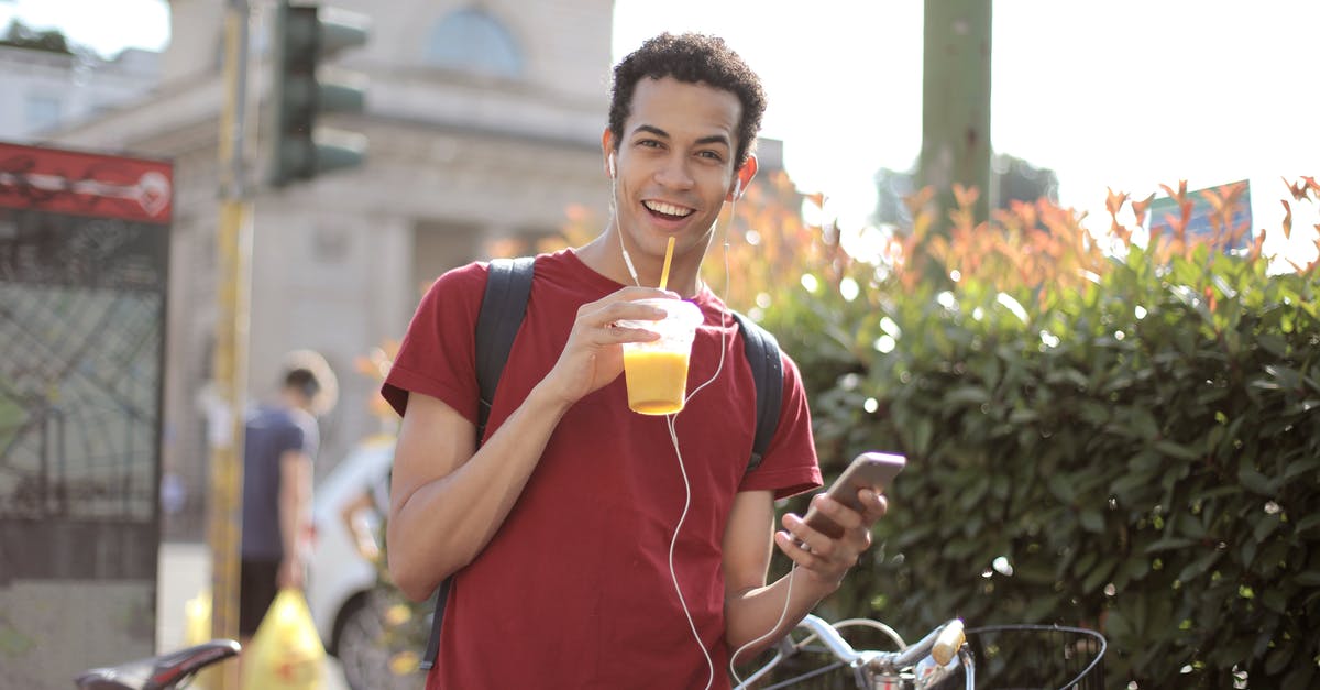 Can I travel across EU with my student visa? - Happy young man using smartphone on street Can I travel across EU with my student visa? - Happy young man using smartphone on street