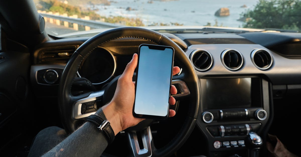 Can I travel inside the US with a digital copy of my passport and visa? - Crop anonymous guy with tattoo on hand navigating on mobile phone while driving car near sea Can I travel inside the US with a digital copy of my passport and visa? - Crop anonymous guy with tattoo on hand navigating on mobile phone while driving car near sea