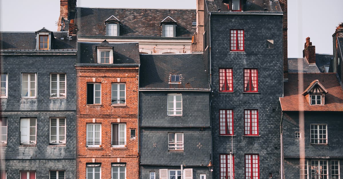 Can I travel to France with my UK residence permit? - Row of old historic stone residential houses with chimneys and windows located in Honfleur town on sunny day Can I travel to France with my UK residence permit? - Row of old historic stone residential houses with chimneys and windows located in Honfleur town on sunny day