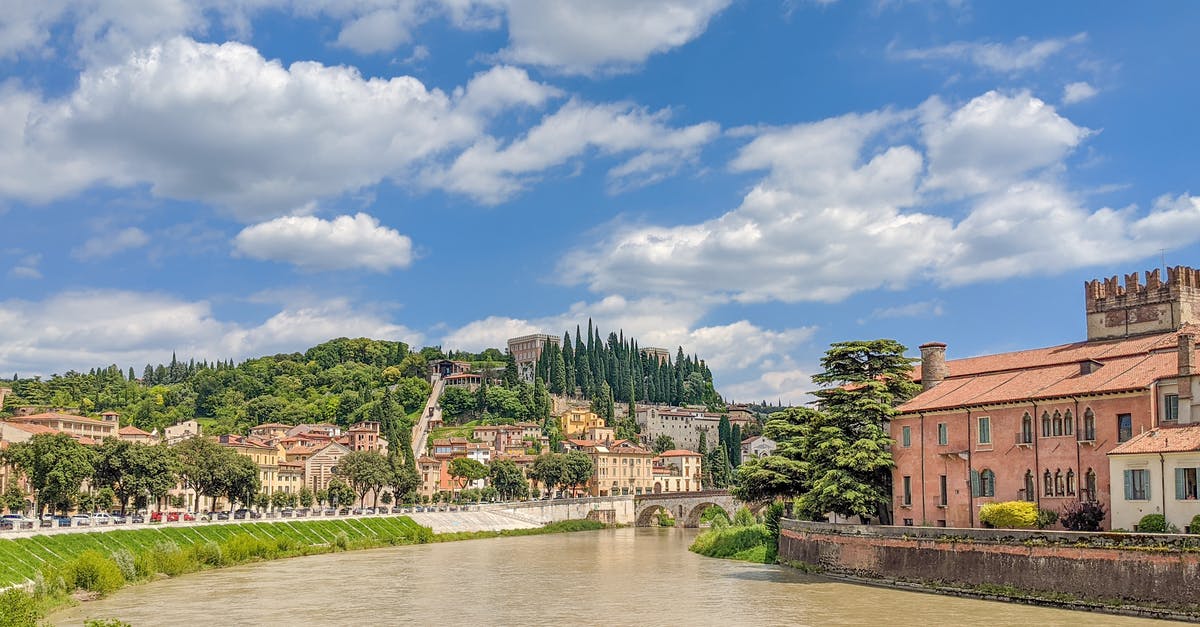 Can I travel to Italy with Bulgarian Visa? - Brown Concrete Building Near River Under Blue Sky Can I travel to Italy with Bulgarian Visa? - Brown Concrete Building Near River Under Blue Sky