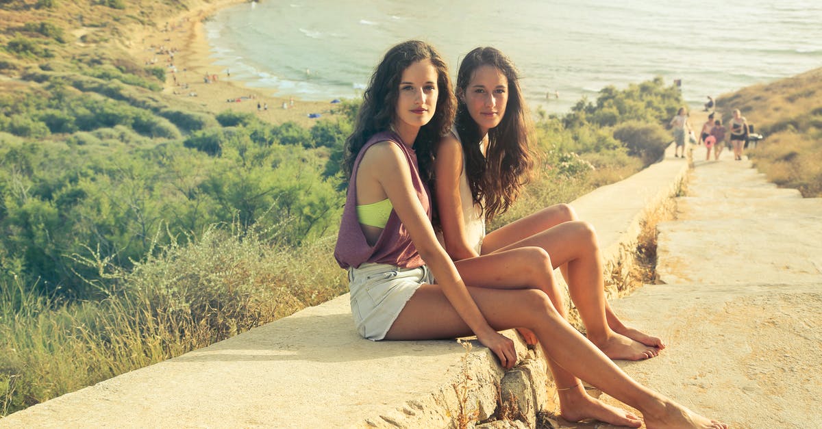 Can I travel to Malta without a visa? - Photo of Teenage Girls Sitting on the Pavement Can I travel to Malta without a visa? - Photo of Teenage Girls Sitting on the Pavement