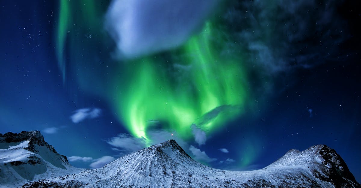 Can I travel to Norway without a visa? - Snow Covered Mountain Under Green Sky Can I travel to Norway without a visa? - Snow Covered Mountain Under Green Sky